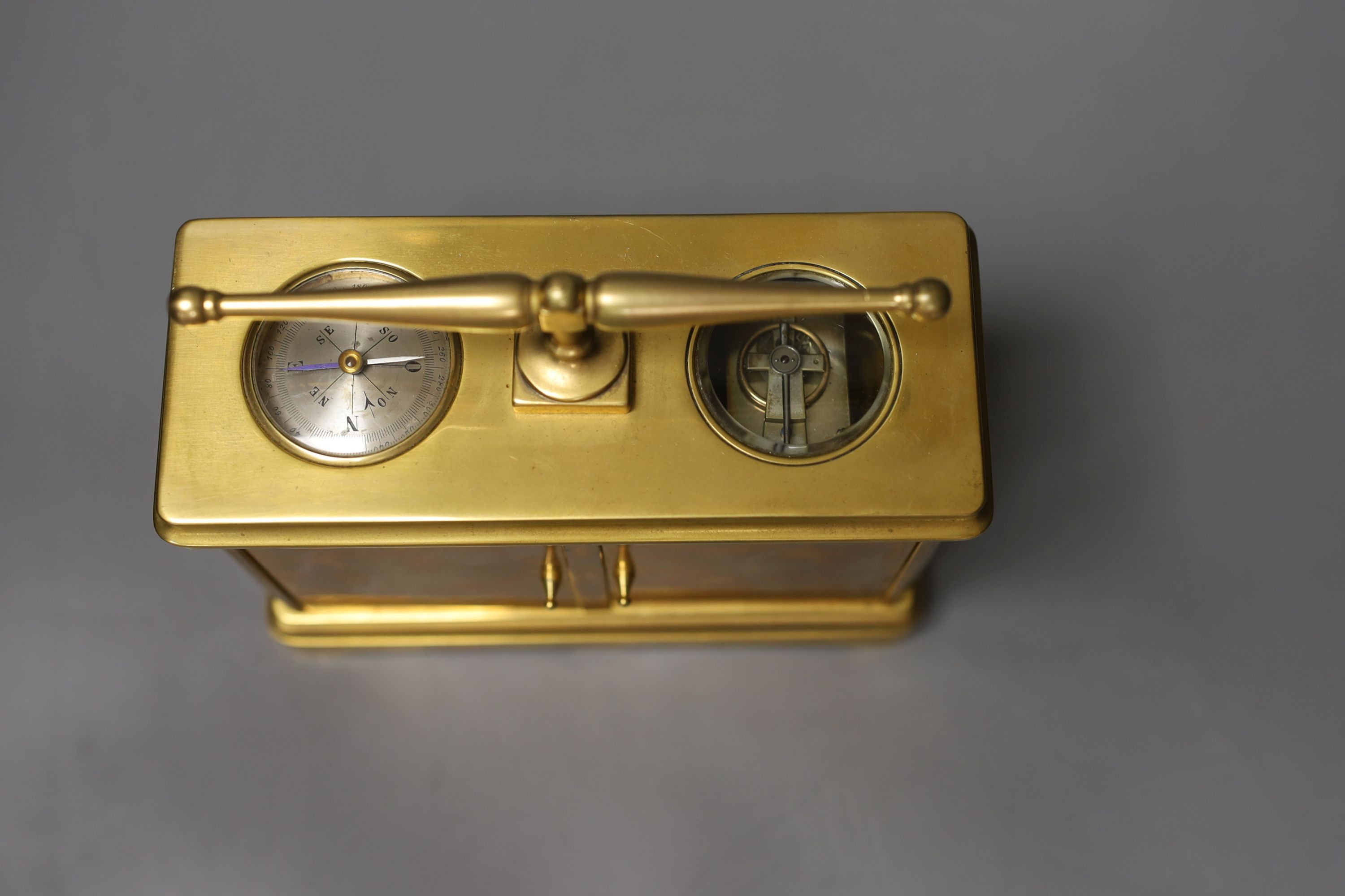 A French combination brass carriage timepiece, barometer, thermometer and compass, retailed by Reed & Son